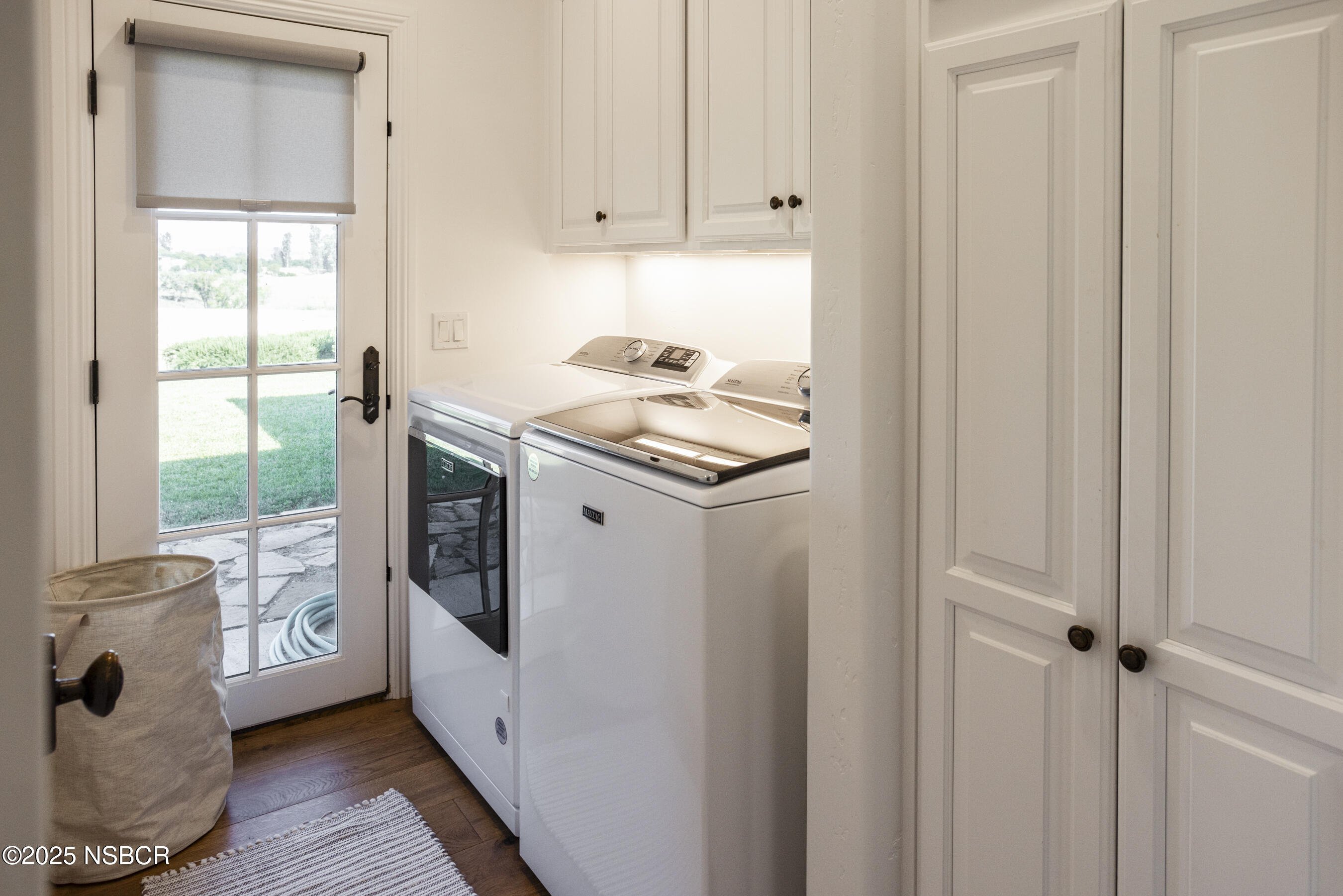 1740 Still Meadow Road Solvang, CA 93463 - Photo 19 of 43 a storage room with wooden floor and windows