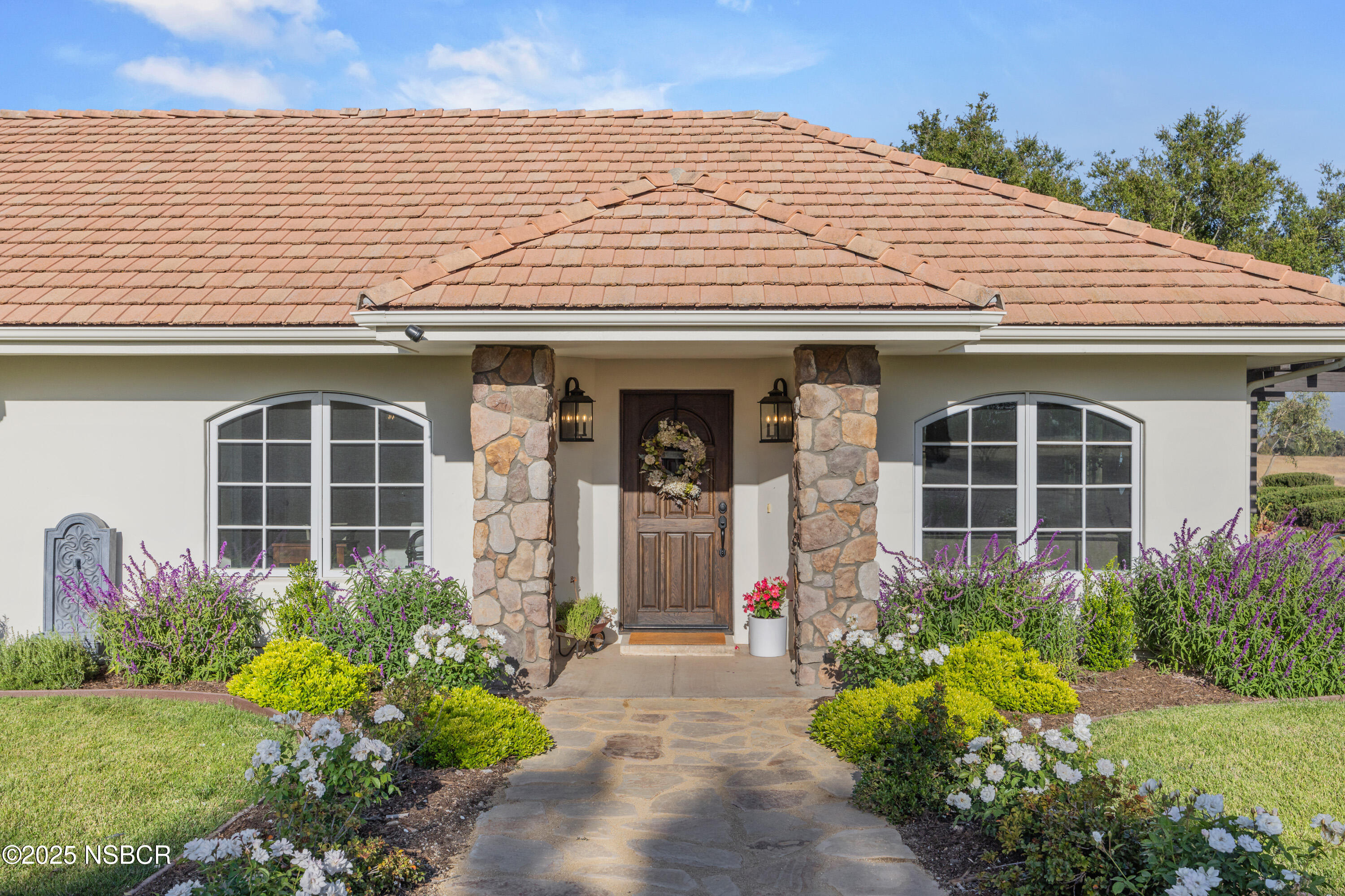 1740 Still Meadow Road Solvang, CA 93463 - Photo 2 of 43 a front view of a house with garden