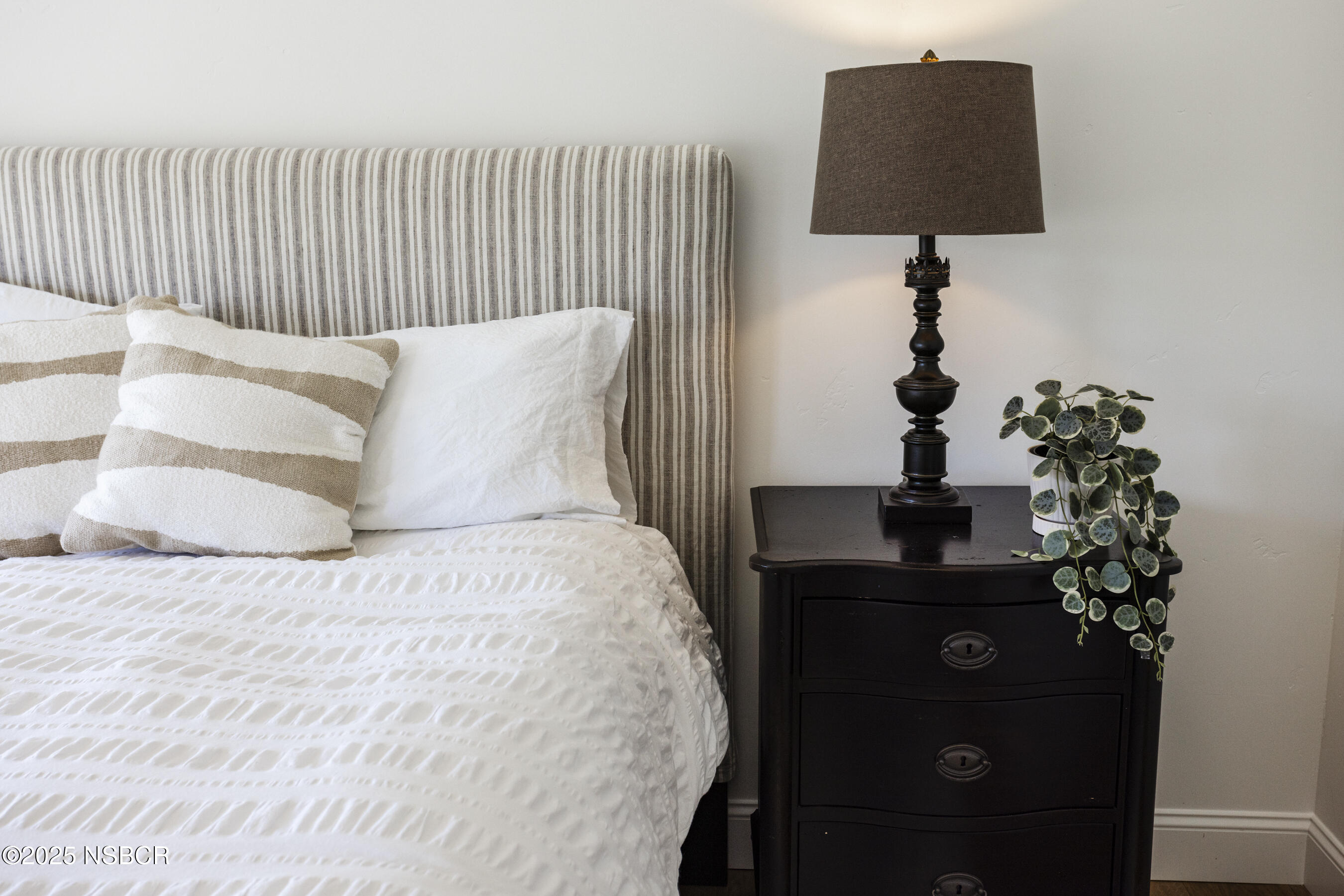 1740 Still Meadow Road Solvang, CA 93463 - Photo 22 of 43 a bed room with a bed and a lamp