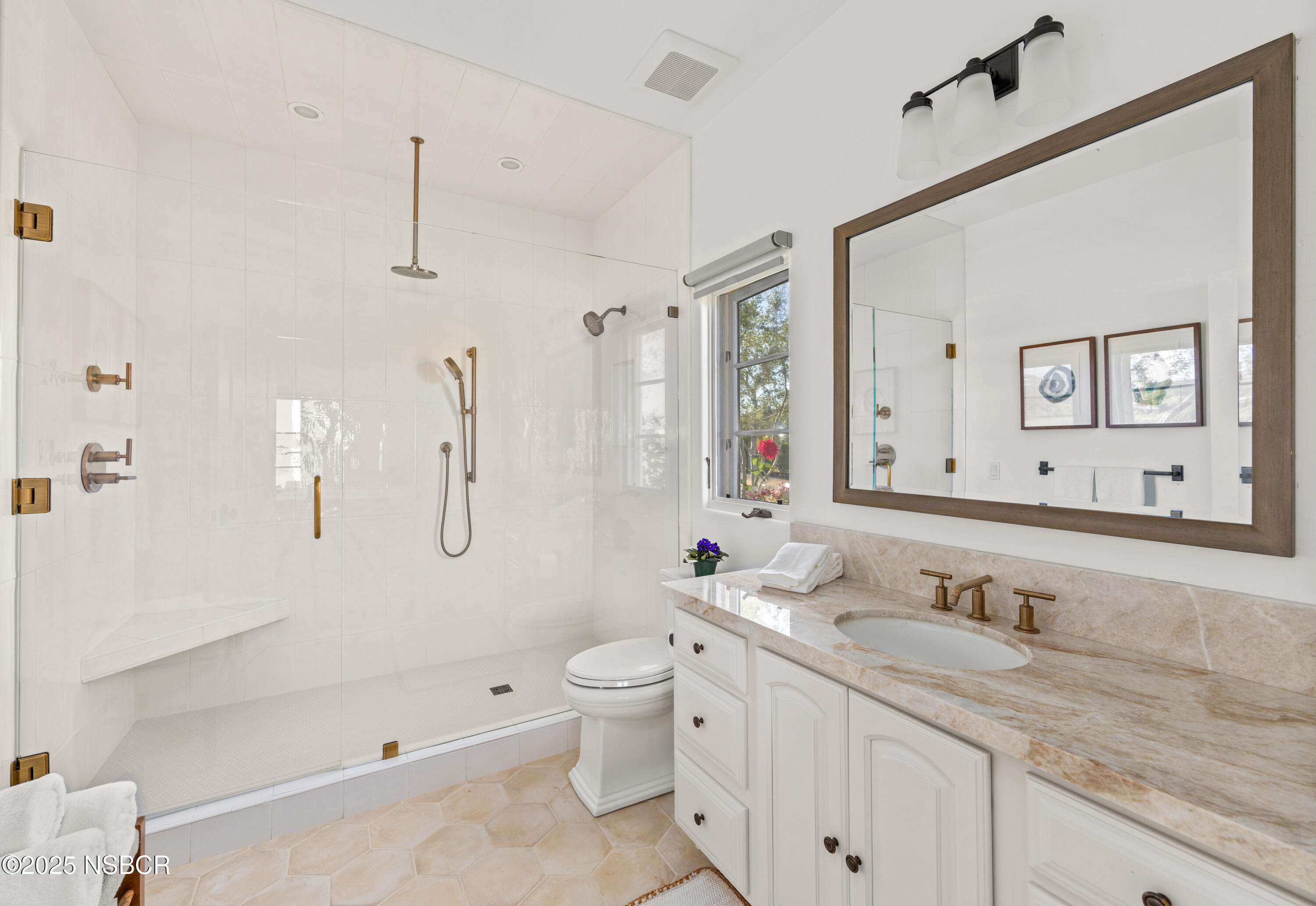 1740 Still Meadow Road Solvang, CA 93463 - Photo 25 of 43 a bathroom with a granite countertop toilet sink and mirror