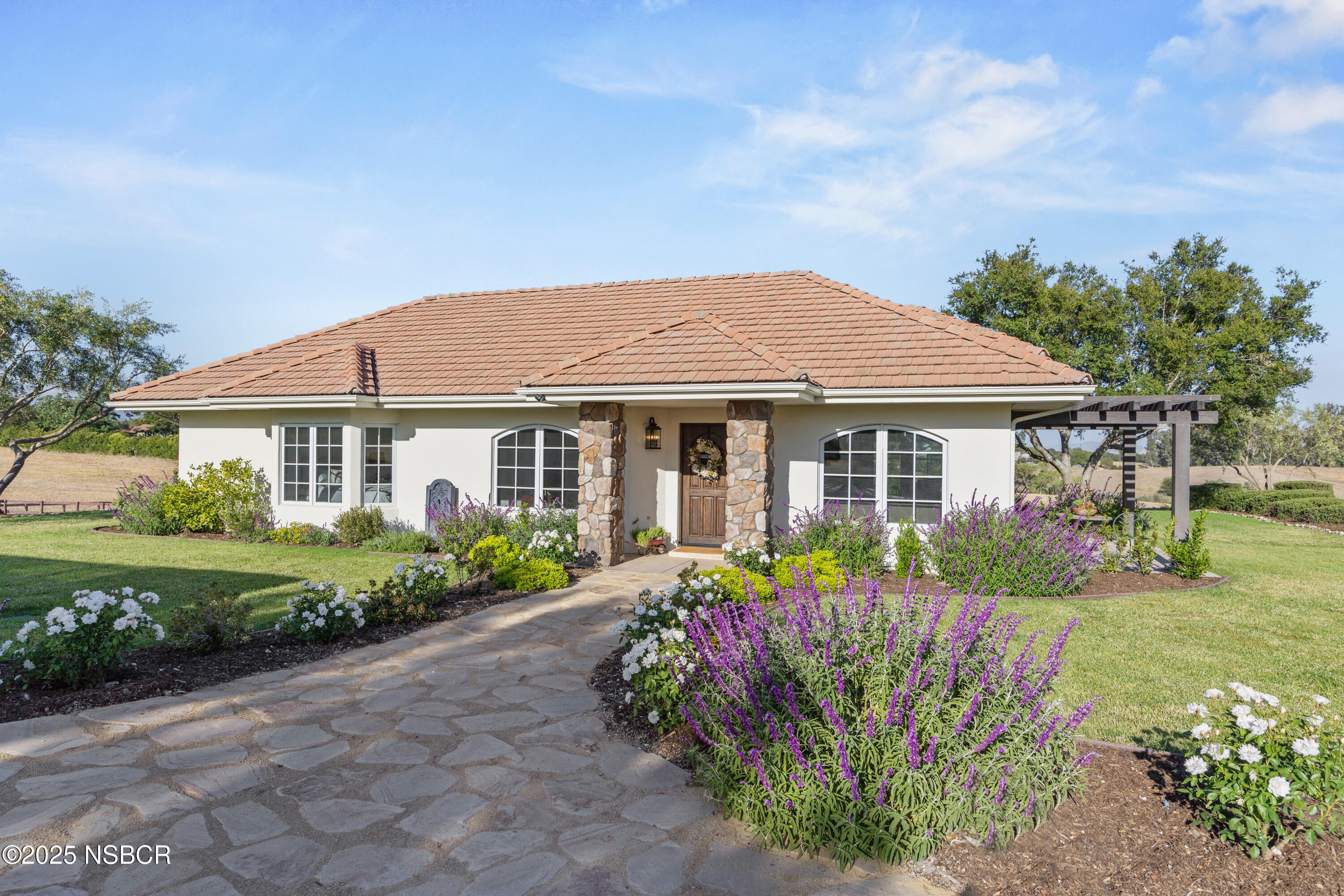 1740 Still Meadow Road Solvang, CA 93463 - Photo 3 of 43 a front view of a house with garden