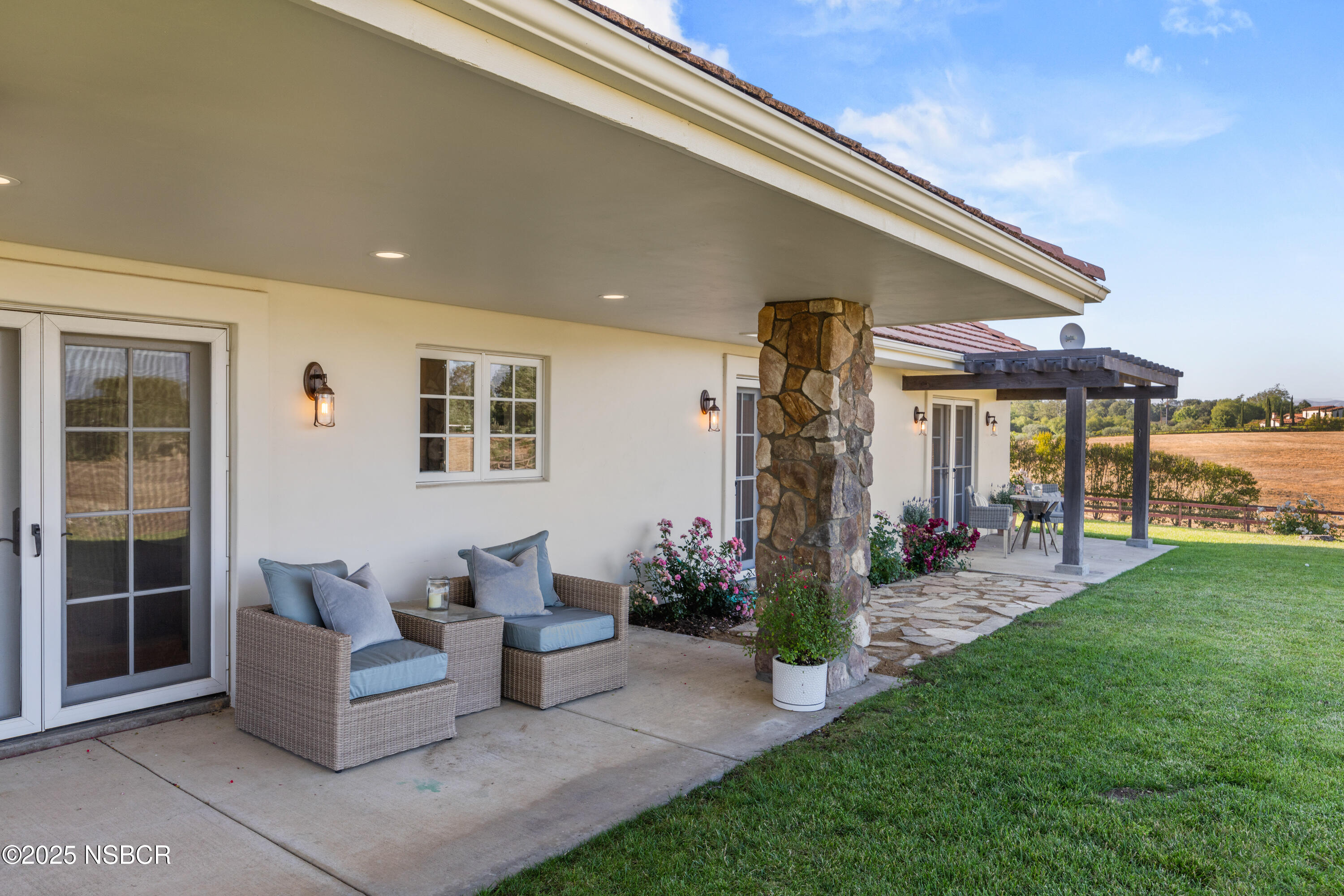 1740 Still Meadow Road Solvang, CA 93463 - Photo 31 of 43 a patio with couches and potted plants with sky view