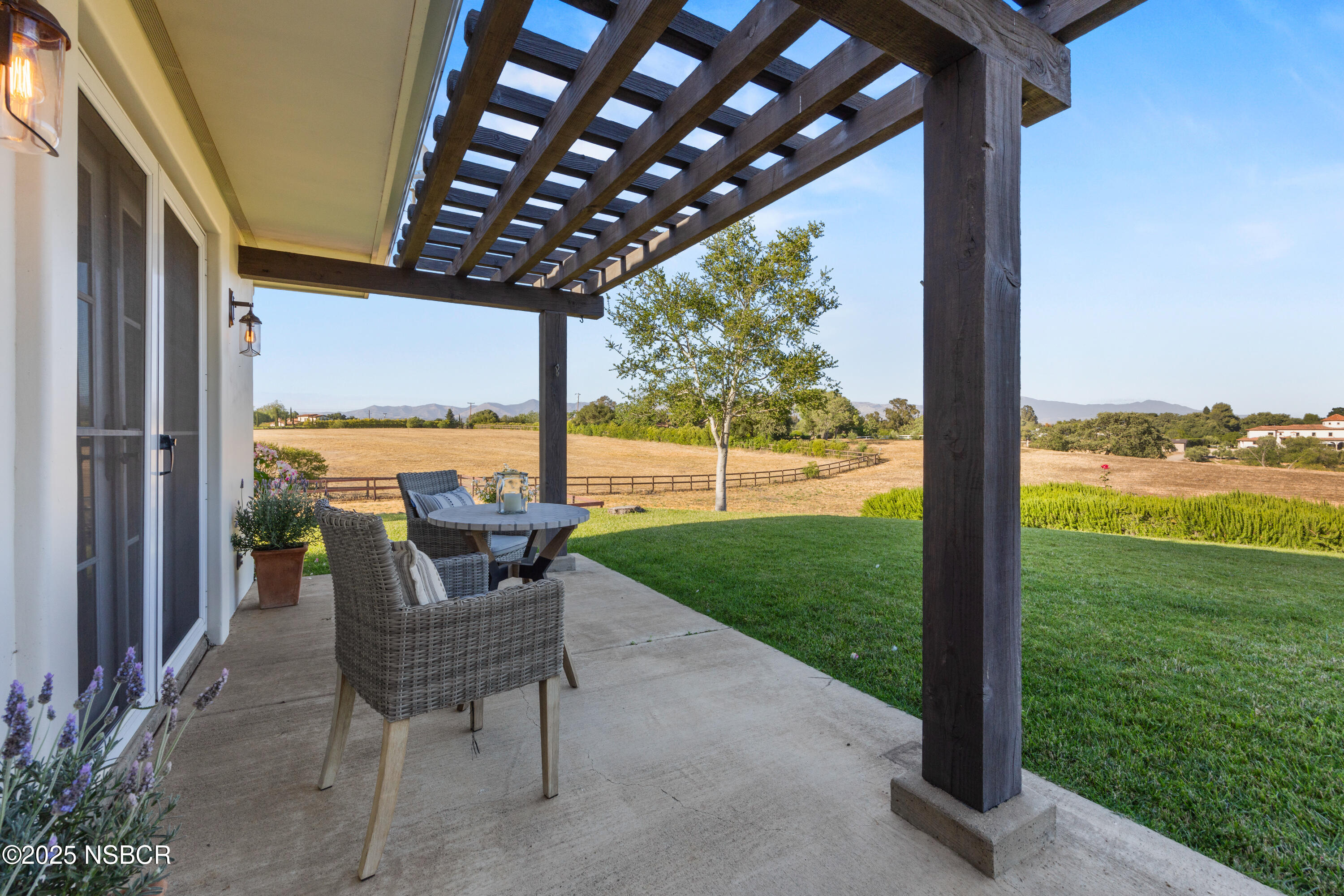 1740 Still Meadow Road Solvang, CA 93463 - Photo 34 of 43 a view of porch with a table chairs and garden