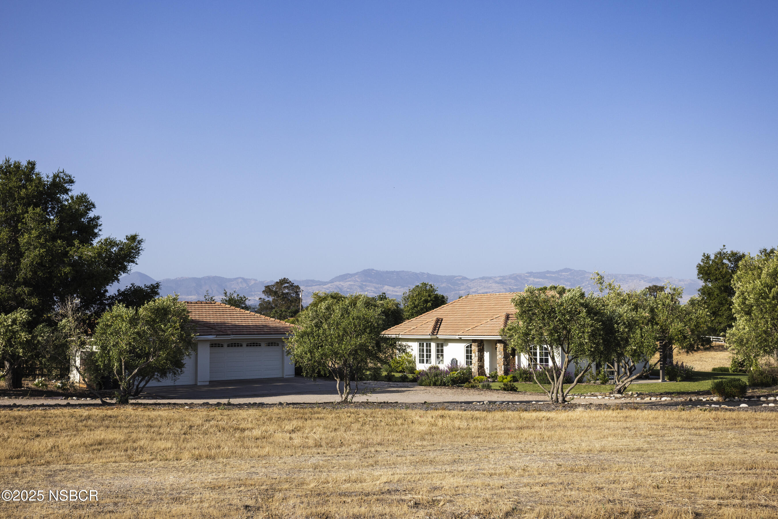 1740 Still Meadow Road Solvang, CA 93463 - Photo 35 of 43 a front view of a house with a yard