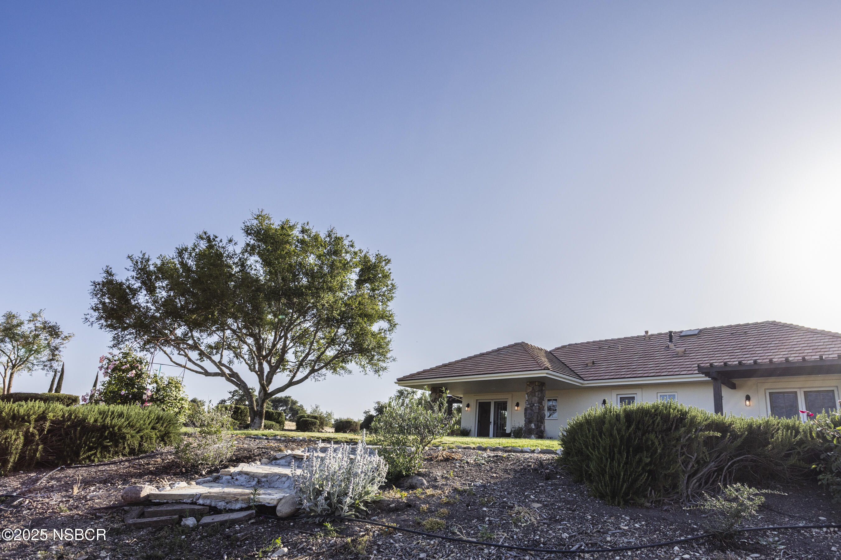 1740 Still Meadow Road Solvang, CA 93463 - Photo 38 of 43 a front view of a house with a yard and a garage
