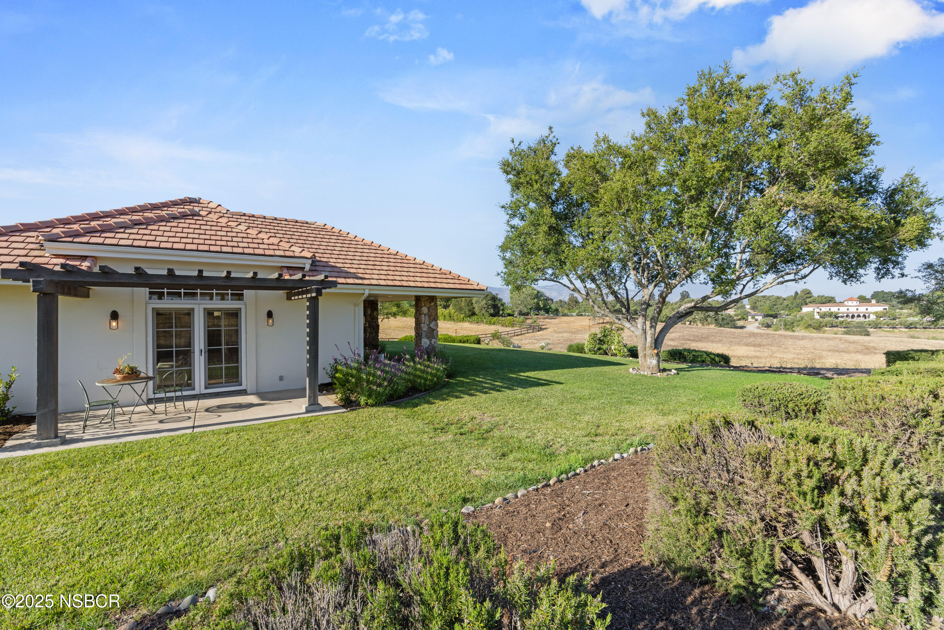 1740 Still Meadow Road Solvang, CA 93463 - Photo 39 of 43 a front view of a house with a yard