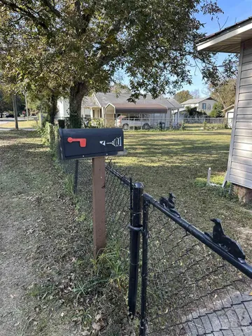 a view of a park with large trees