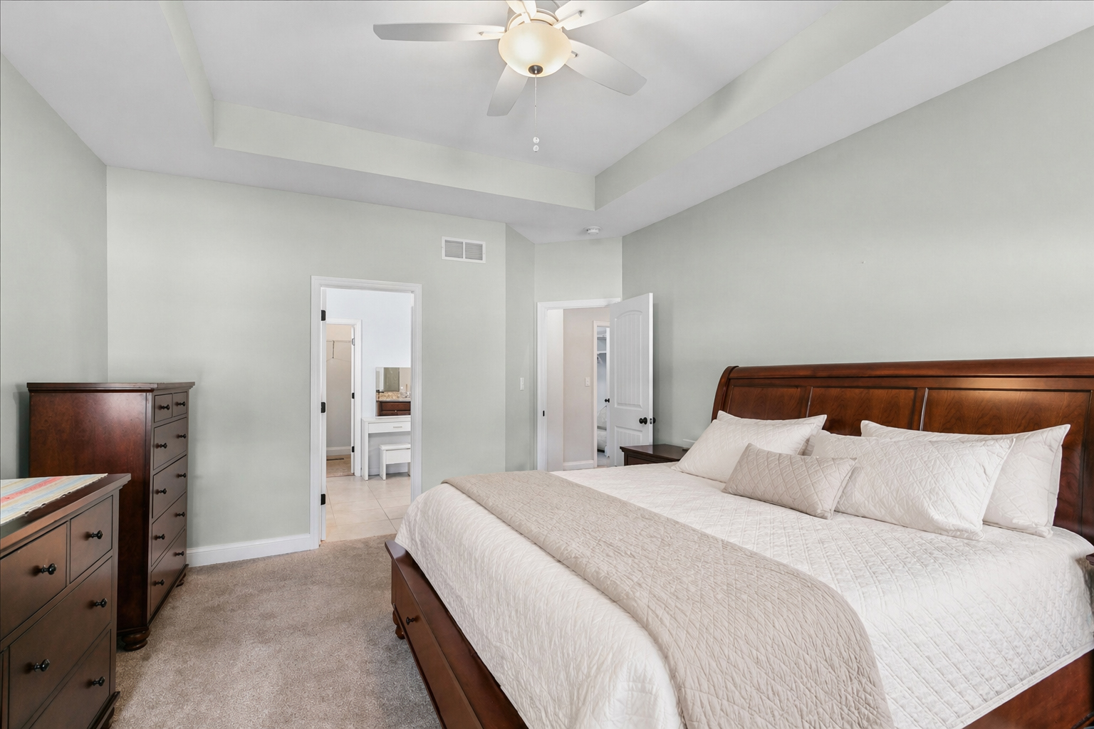 1015 Meadow Path Manteno, IL 60950 - Photo 12 of 26 a bedroom with a bed and a chandelier