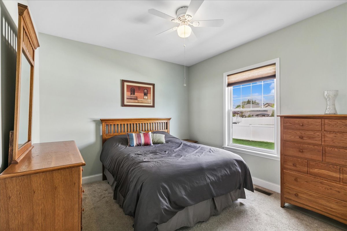 1015 Meadow Path Manteno, IL 60950 - Photo 15 of 26 a bedroom with a bed and a window