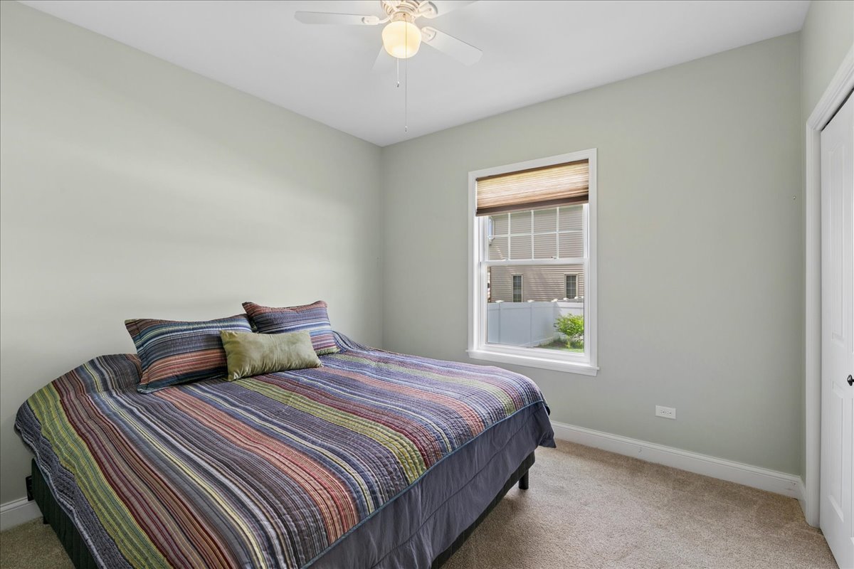1015 Meadow Path Manteno, IL 60950 - Photo 18 of 26 a bedroom with a bed and a window