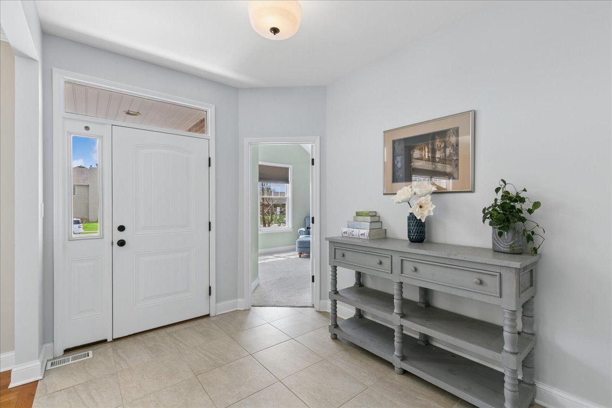 1015 Meadow Path Manteno, IL 60950 - Photo 3 of 26 a spacious bedroom with a bed and a dresser