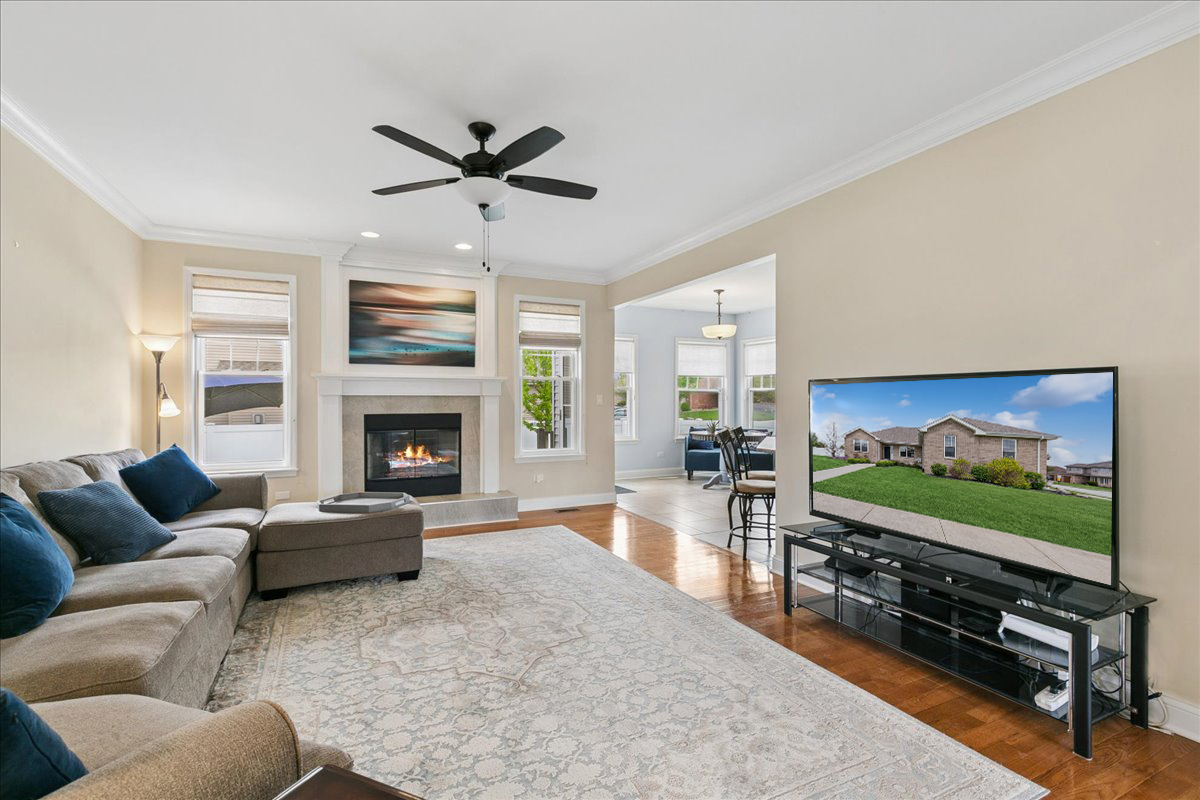 1015 Meadow Path Manteno, IL 60950 - Photo 6 of 26 a living room with furniture and a flat screen tv
