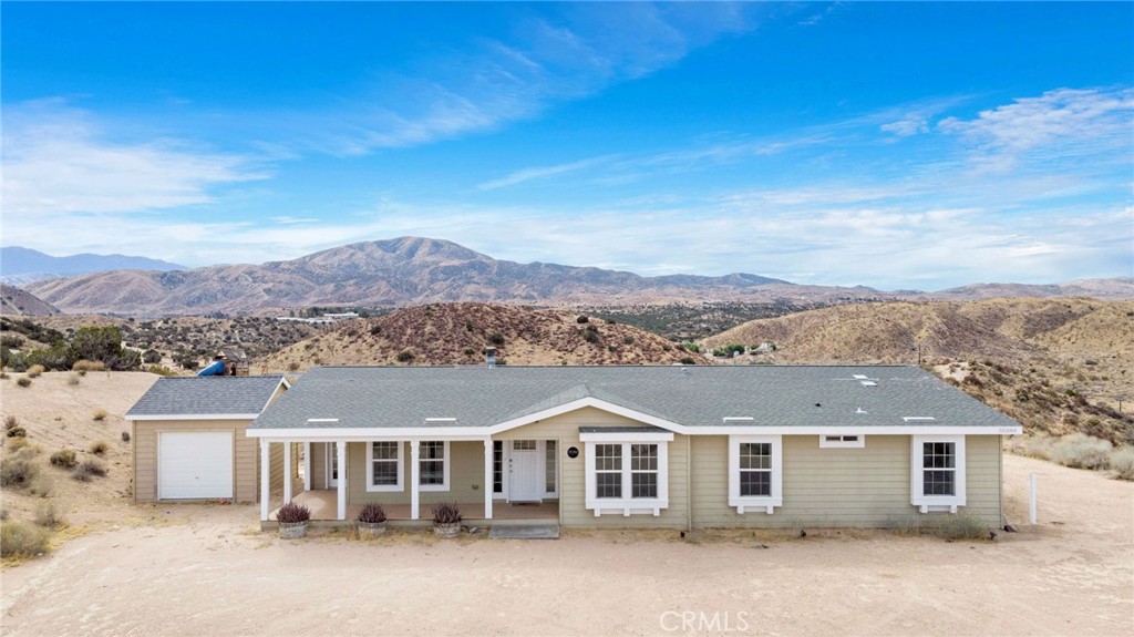 35380 Cheseboro Road Palmdale, CA 93552 - Photo 2 of 42 front view of a house with a yard