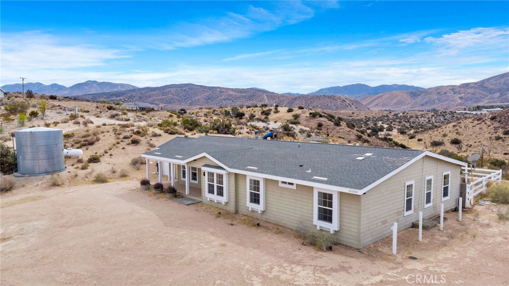 35380 Cheseboro Road Palmdale, CA 93552 - Photo 29 of 42 a view of a house with a mountain in the background
