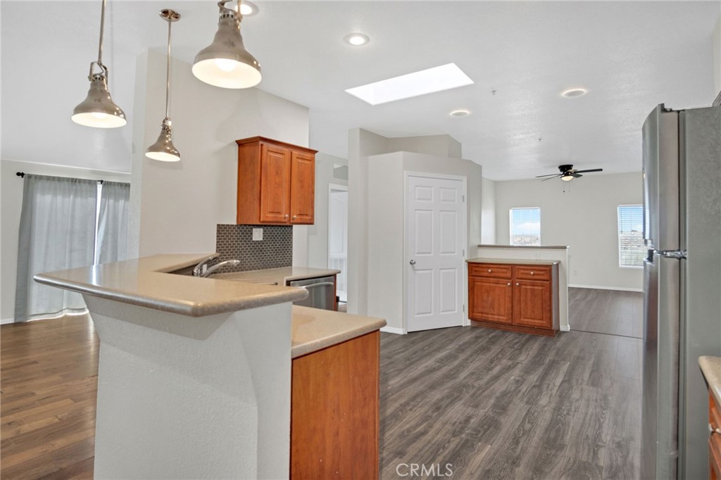35380 Cheseboro Road Palmdale, CA 93552 - Photo 4 of 42 a kitchen with stainless steel appliances granite countertop a sink a stove and a refrigerator