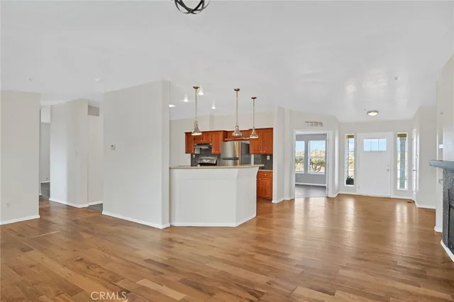 a view of kitchen with furniture and wooden floor