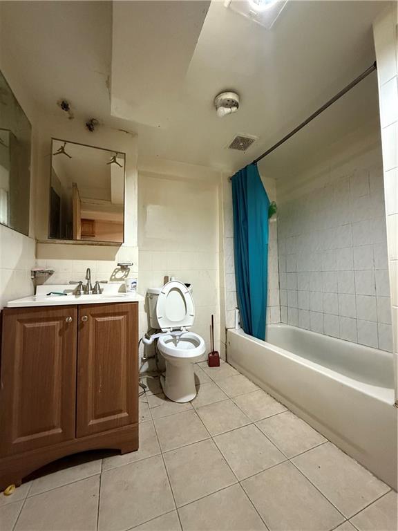 436 77th Street Brooklyn, NY 11209 - Photo 7 of 7 a bathroom with a sink a toilet and mirror