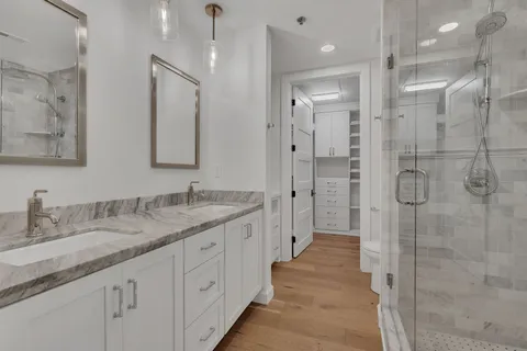 a view of walk in closet with empty racks