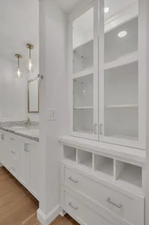 a bathroom with a double vanity sink and a mirror