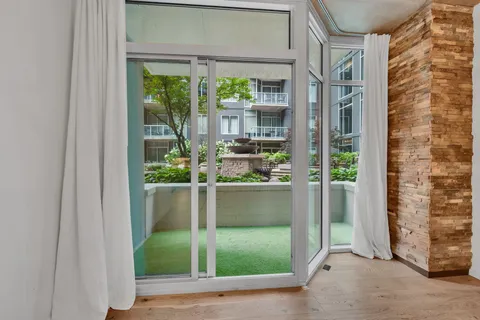 a front view of a house with lots of potted plants