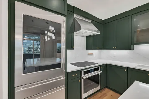 a kitchen with a sink and a refrigerator