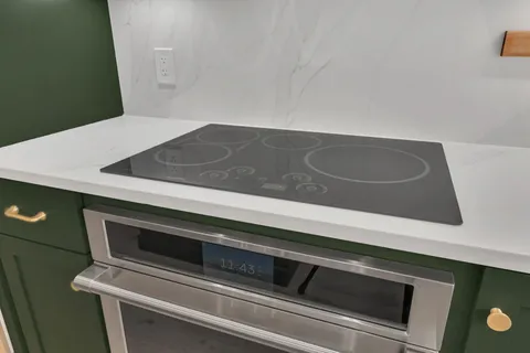 a kitchen with a stove and a refrigerator