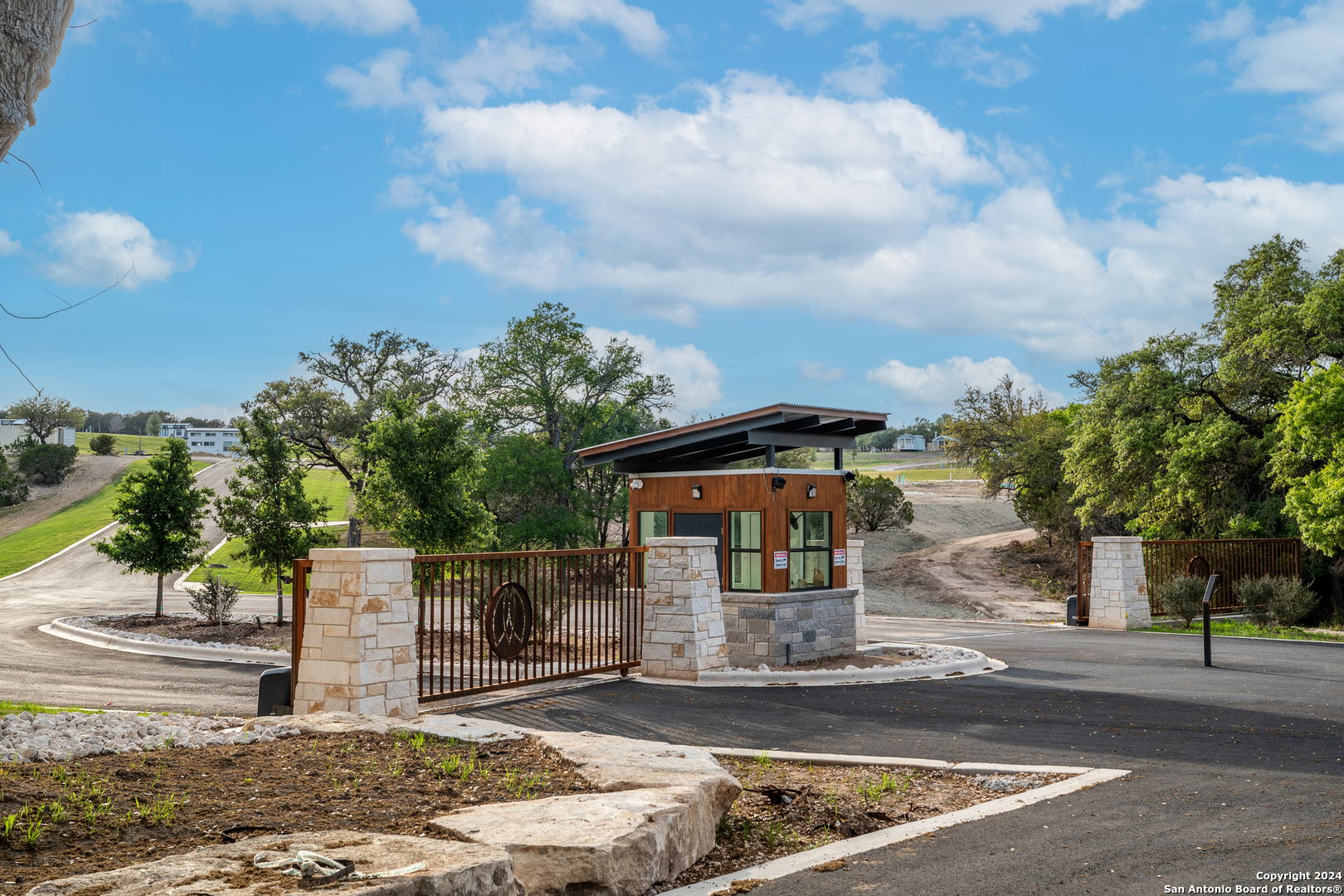 5386 Ranch Road 1376, Unit 101 Fredericksburg, TX 78624 - Photo 12 of 27 a front view of a house with garden