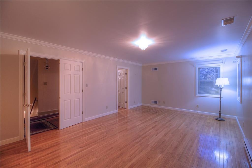 137 Briercliff Road Beaver Falls, PA 15010 - Photo 14 of 25 French doors welcome you to the generous Master Bedroom, boasting hardwood floors and several windows overlooking the landscaped yard. It adjoins to the 10x10 4th Bedroom, currently used as a walk-in-closet!