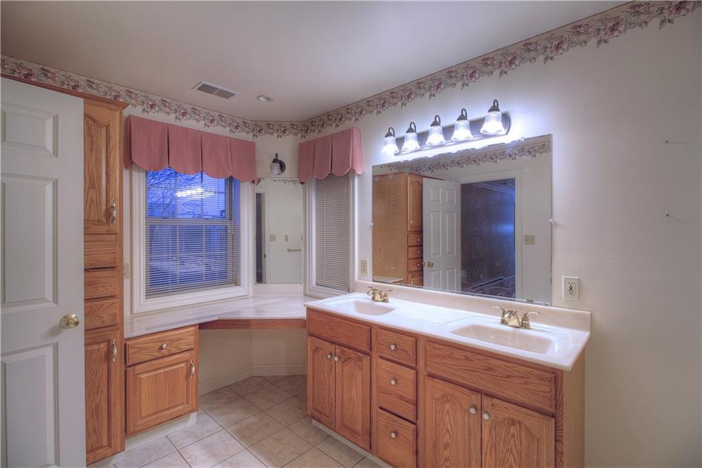 137 Briercliff Road Beaver Falls, PA 15010 - Photo 18 of 25 The Master Bath addition features dual sinks, oak cabinetry, a linen closet and ceramic tile flooring!