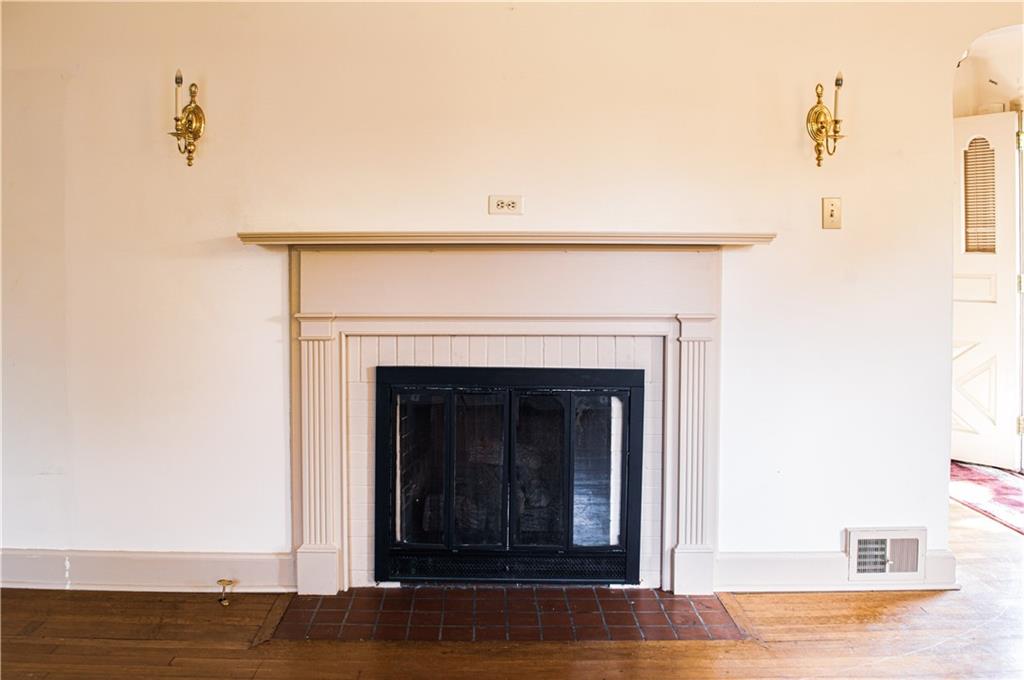137 Briercliff Road Beaver Falls, PA 15010 - Photo 6 of 25 True to the colonial style, note the sconces and detailed trim of the fireplace in the cozy, formal living room