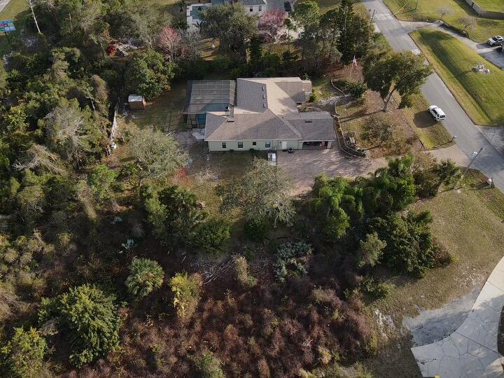 3916 Hunters Ridge Way Titusville, FL 32796 - Photo 33 of 35 3916 Drone side view