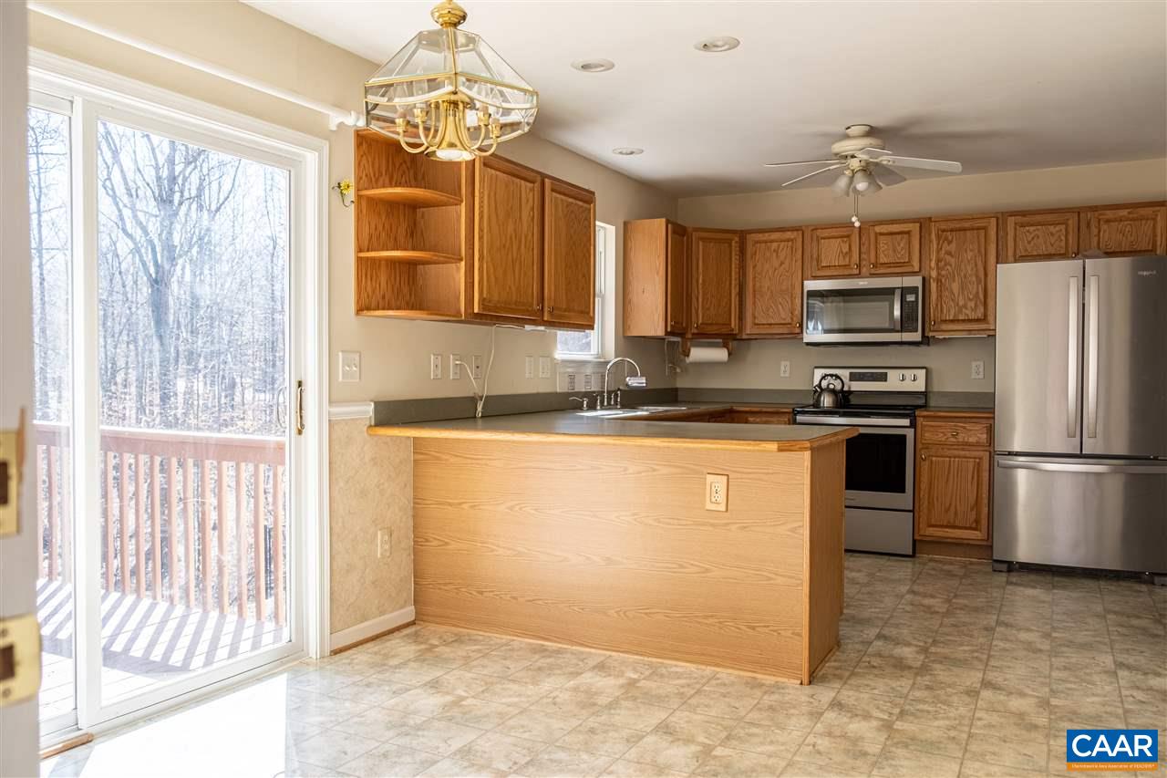 29 East Point Road Palmyra, VA 22963 - Photo 14 of 33 a kitchen with kitchen island a counter top space appliances and a window