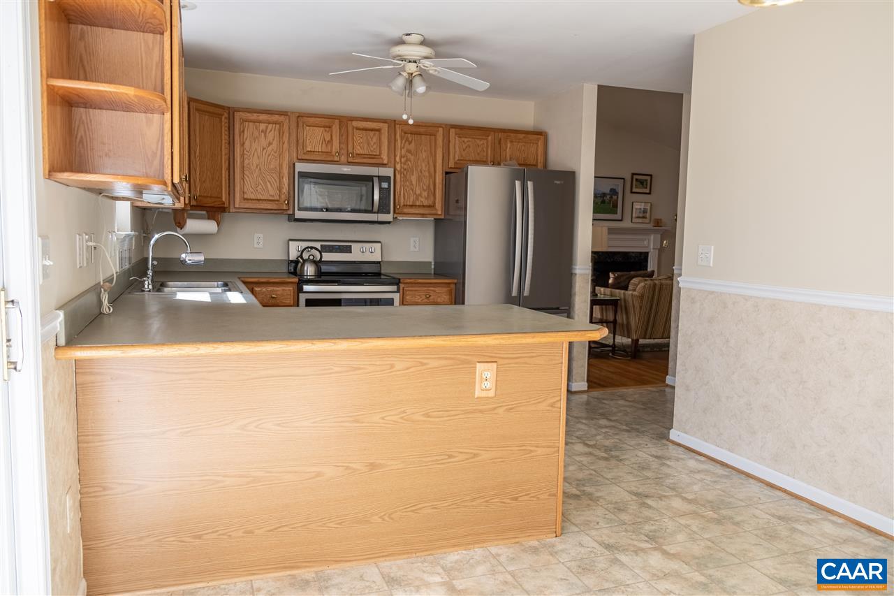 29 East Point Road Palmyra, VA 22963 - Photo 15 of 33 a kitchen with stainless steel appliances a refrigerator a stove a sink a microwave and cabinets