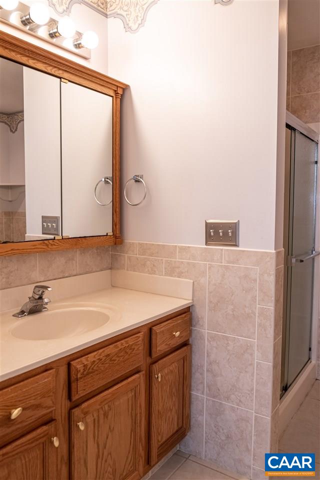 29 East Point Road Palmyra, VA 22963 - Photo 18 of 33 a bathroom with a sink and a mirror