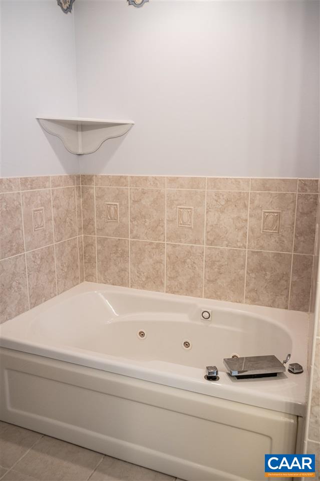 29 East Point Road Palmyra, VA 22963 - Photo 19 of 33 a bathroom with a bathtub and shower