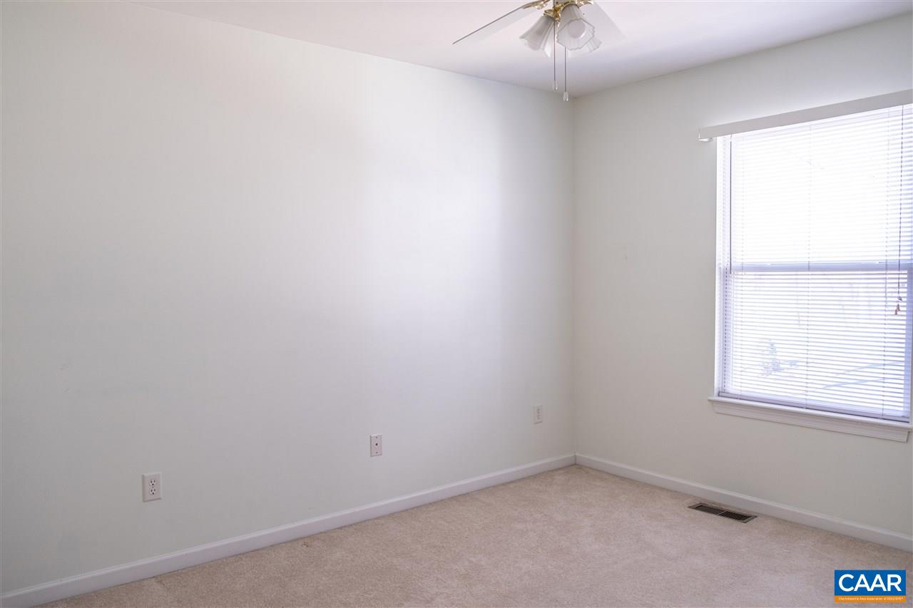 29 East Point Road Palmyra, VA 22963 - Photo 23 of 33 an empty room with a window and a chandelier fan