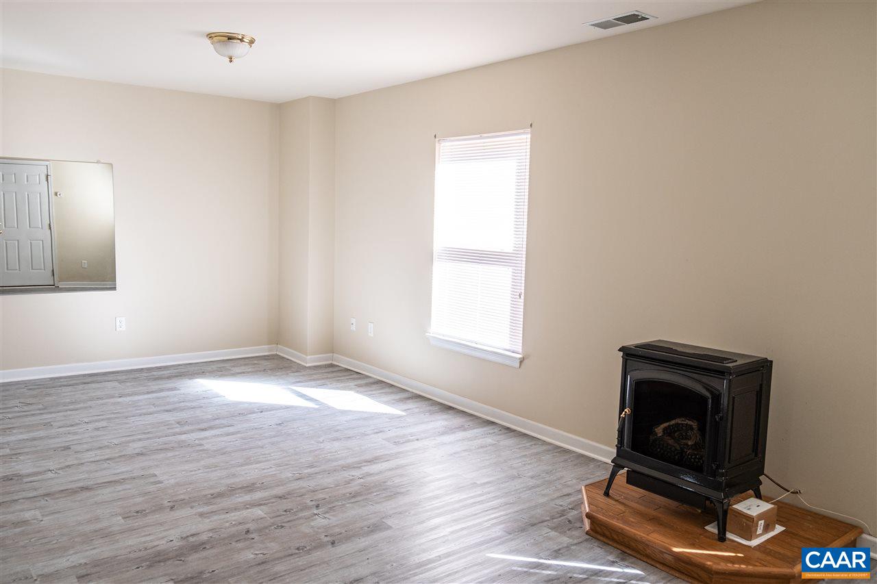 29 East Point Road Palmyra, VA 22963 - Photo 26 of 33 a view of an empty room with wooden floor and a window