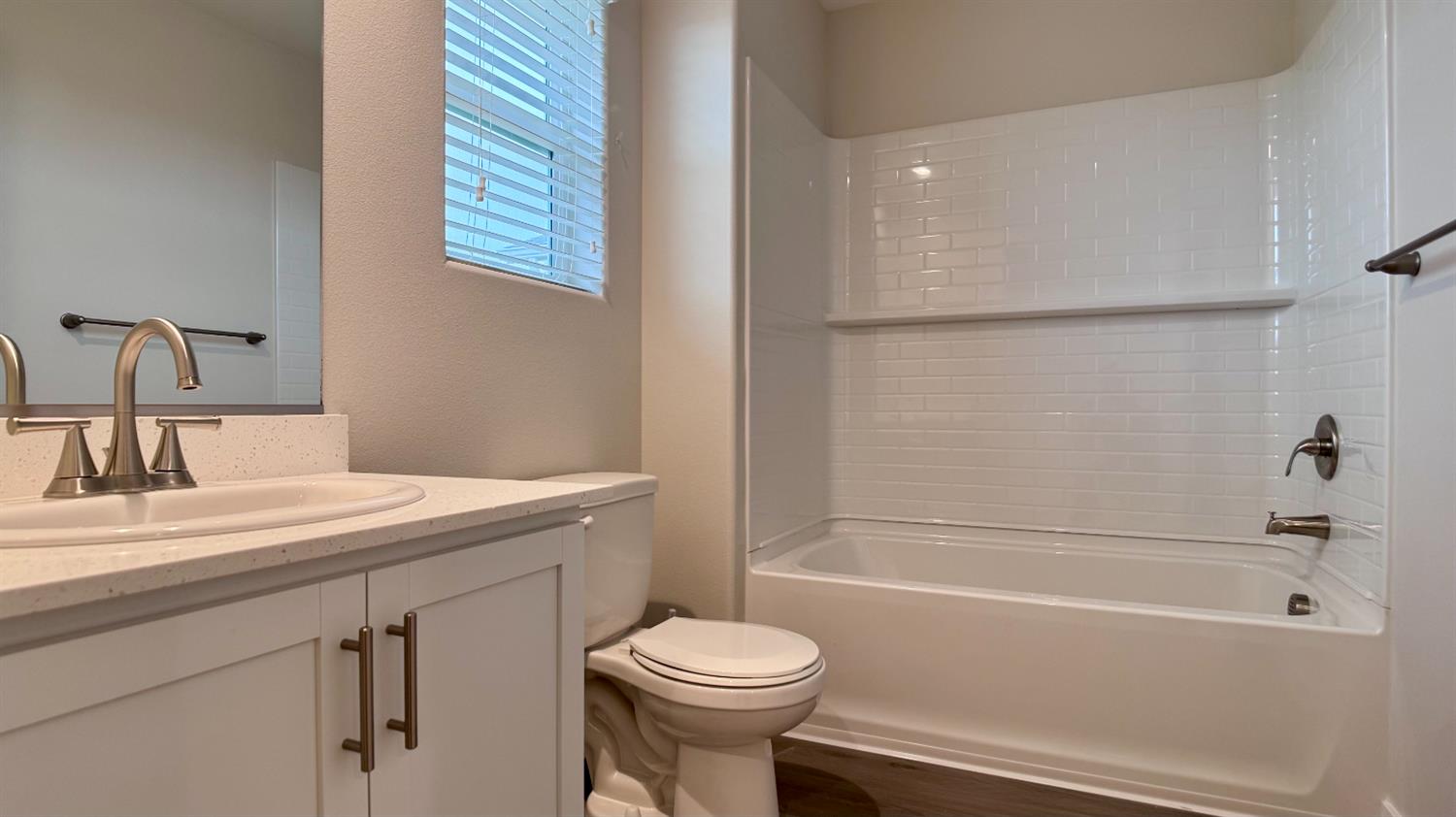 4163 Vincent Road Madera, CA 93636 - Photo 12 of 17 a bathroom with a sink toilet and shower