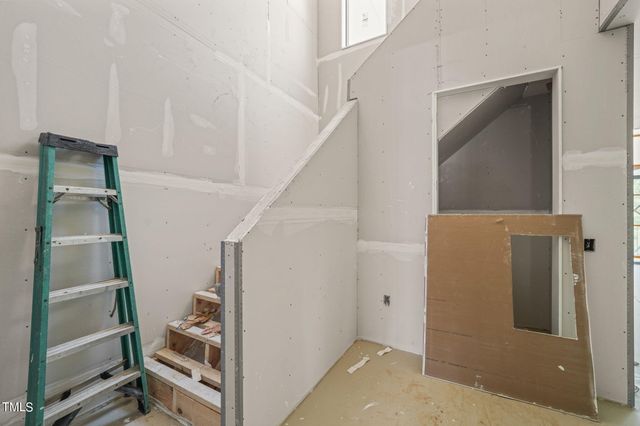 a bed room with a bed and a window