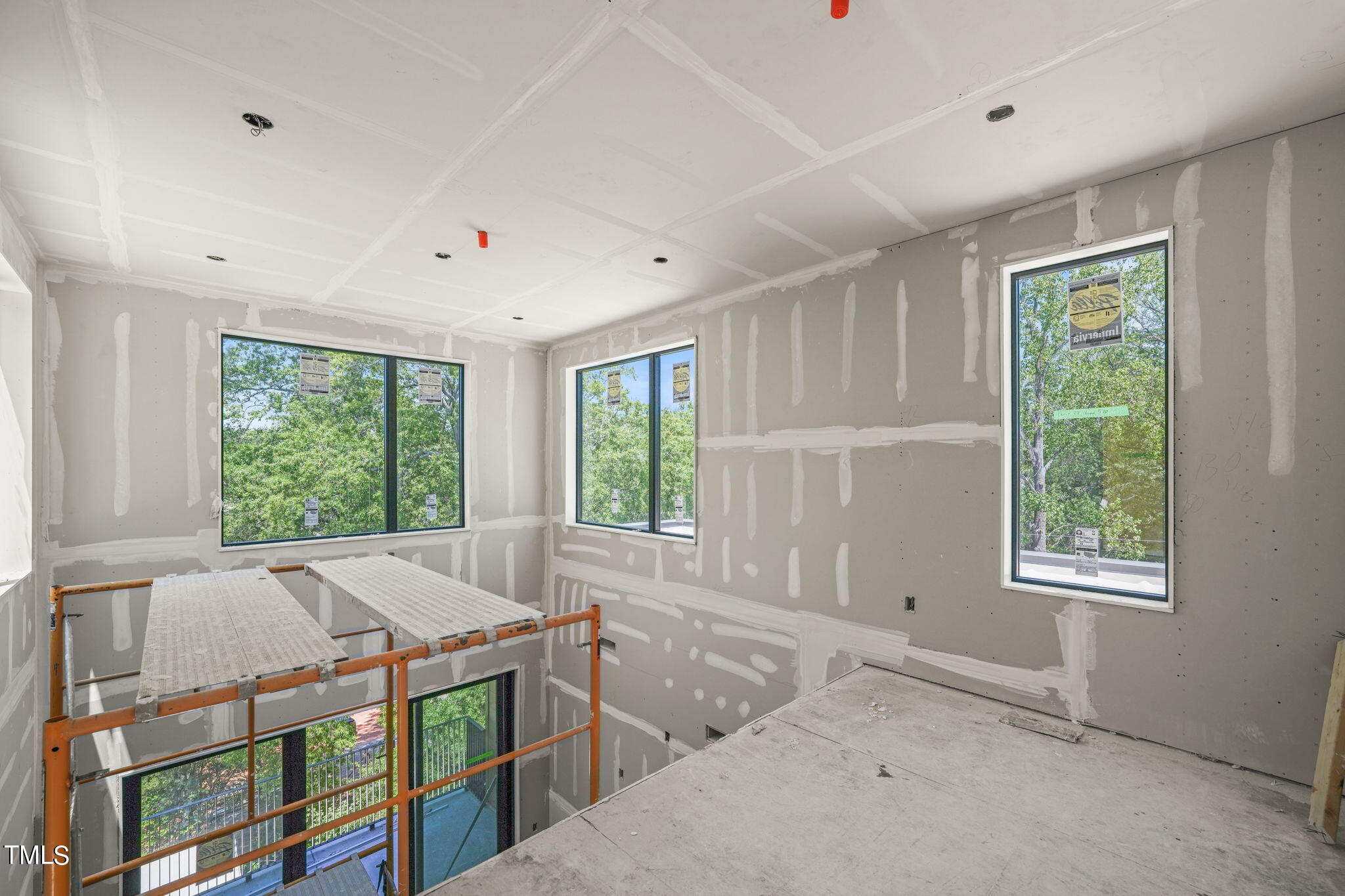 29 Enterprise Street, Unit 311 Raleigh, NC 27607 - Photo 14 of 33 a bed room with a bed and a window