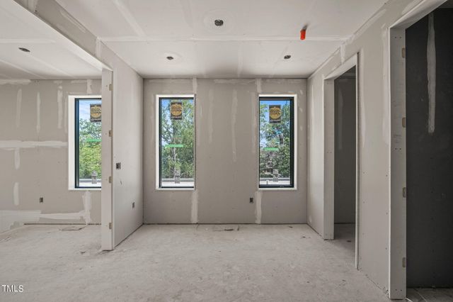 a balcony view with a wrought fence