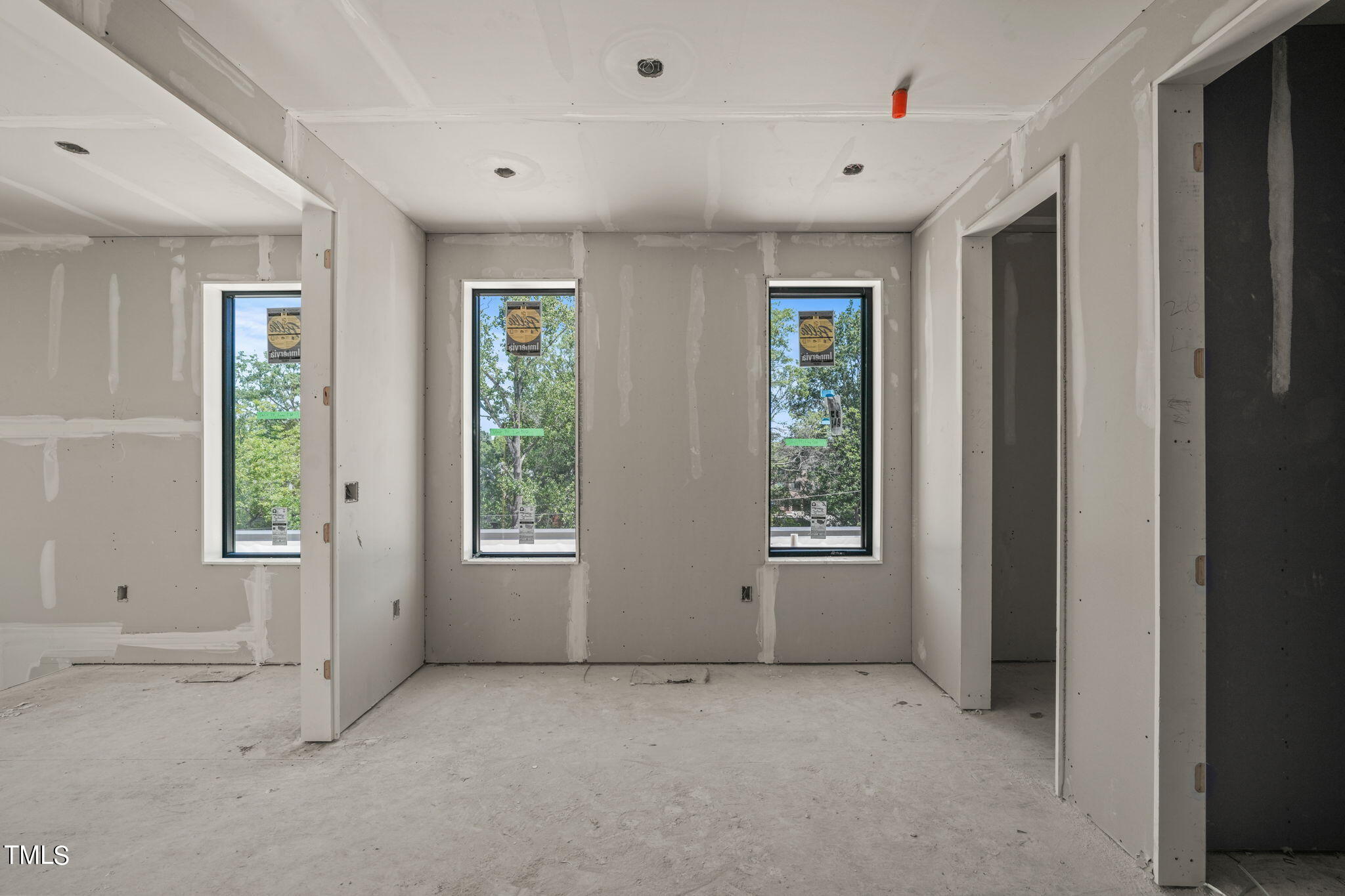 29 Enterprise Street, Unit 311 Raleigh, NC 27607 - Photo 16 of 33 an empty room with windows and closet