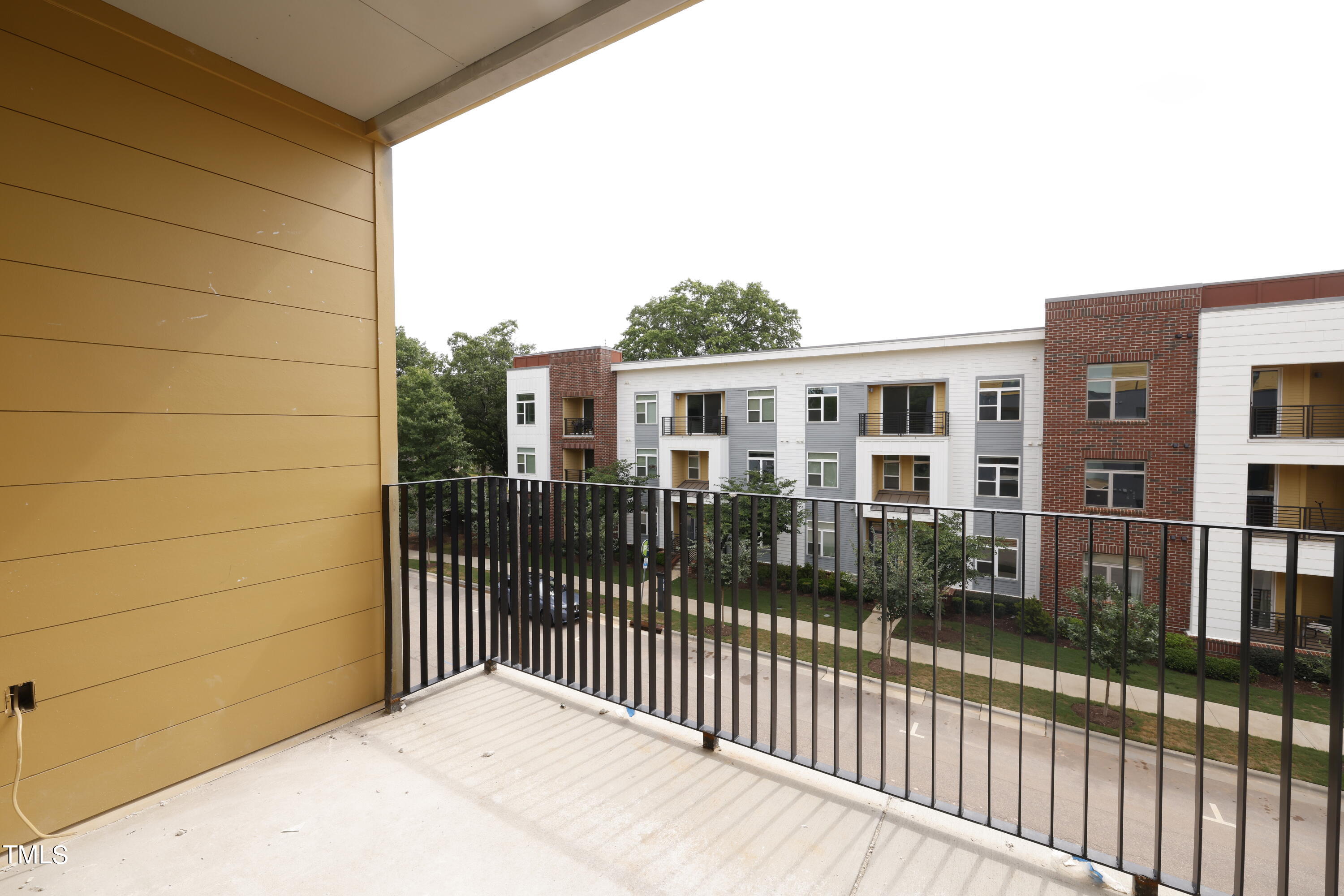 29 Enterprise Street, Unit 311 Raleigh, NC 27607 - Photo 17 of 33 a balcony view with a wrought fence