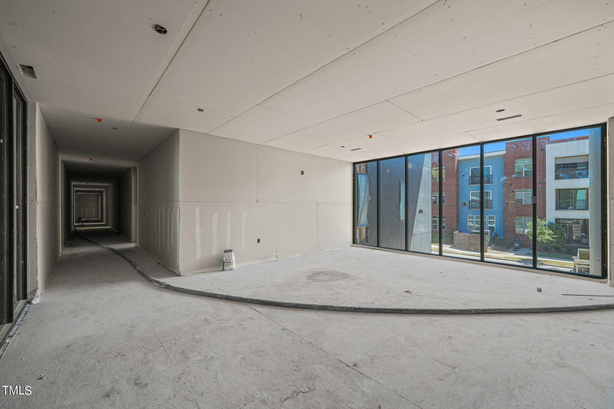 29 Enterprise Street, Unit 311 Raleigh, NC 27607 - Photo 21 of 33 a view of an empty room with a window