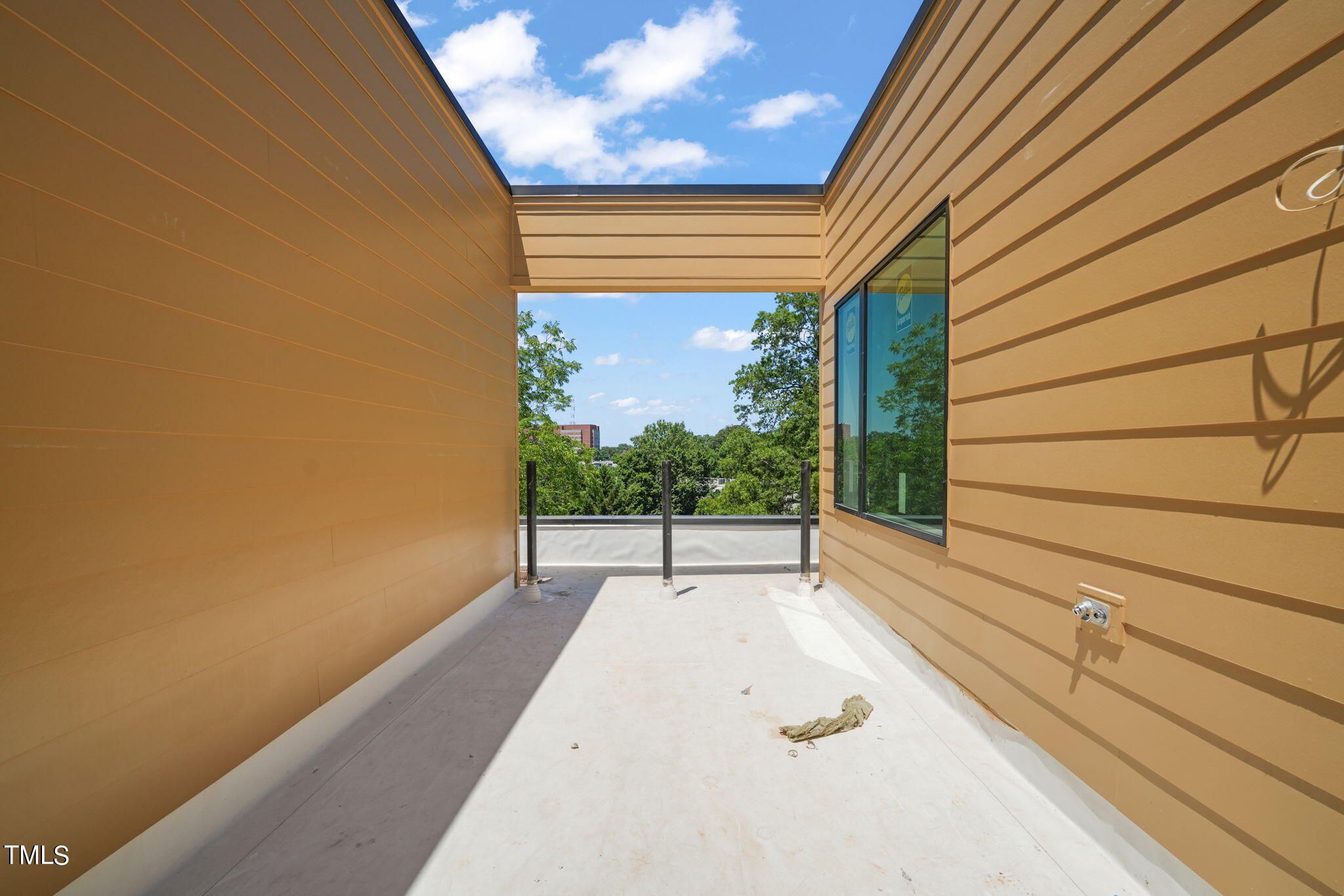 29 Enterprise Street, Unit 311 Raleigh, NC 27607 - Photo 24 of 33 a view of a porch with wooden floor and a bench
