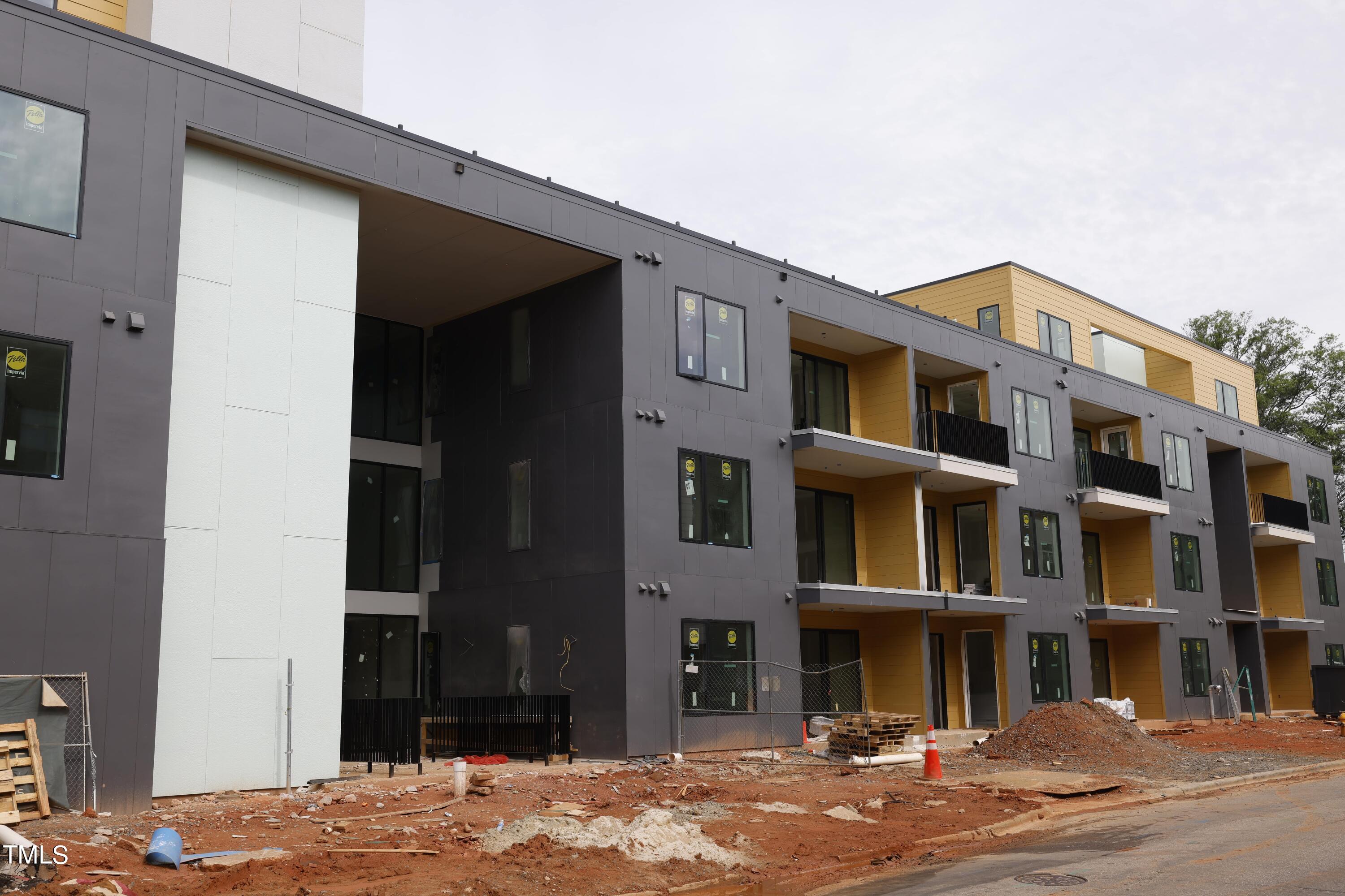 29 Enterprise Street, Unit 311 Raleigh, NC 27607 - Photo 30 of 33 a front view of a building with a street