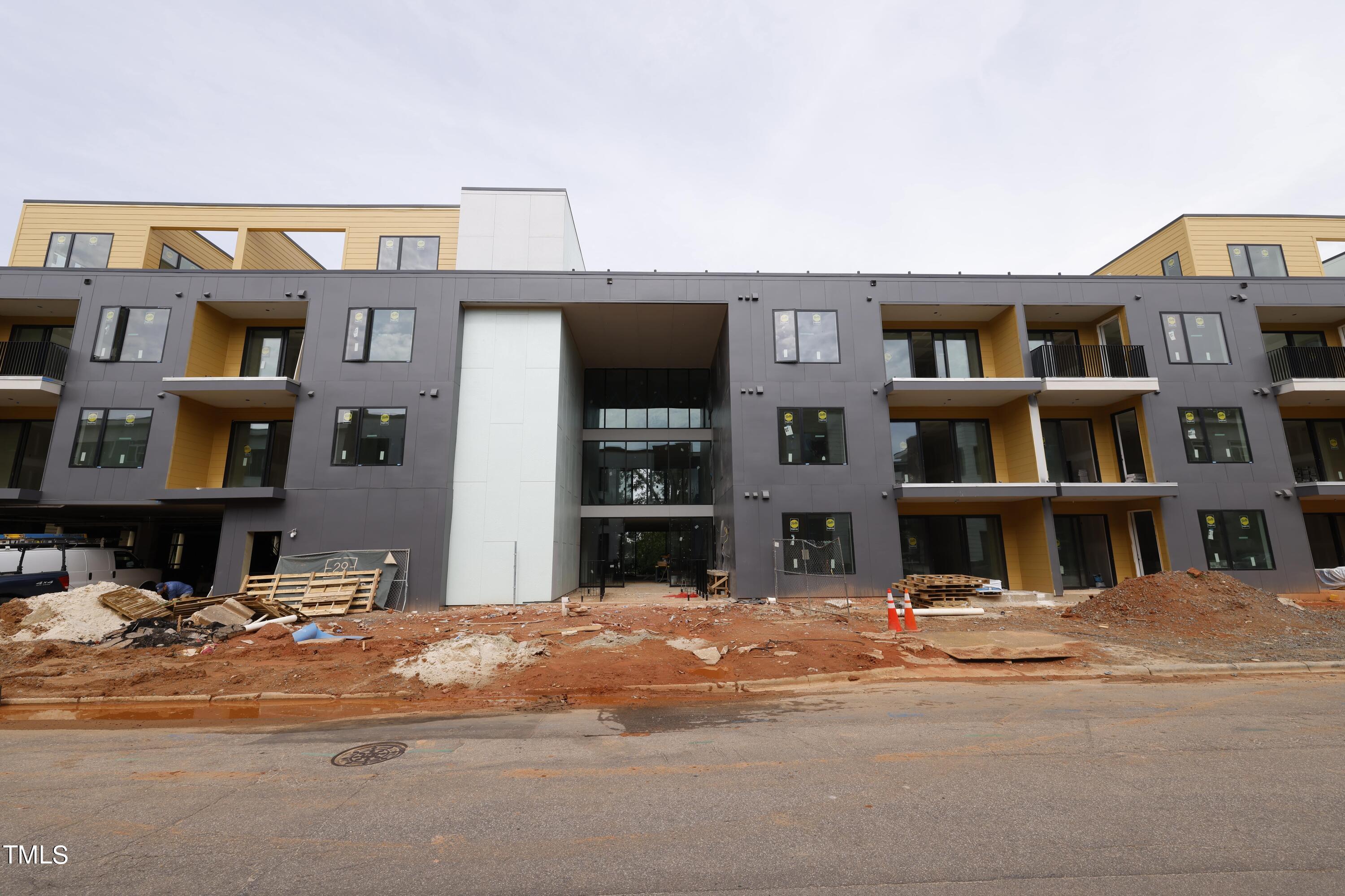 29 Enterprise Street, Unit 311 Raleigh, NC 27607 - Photo 31 of 33 a view of building with lot of windows