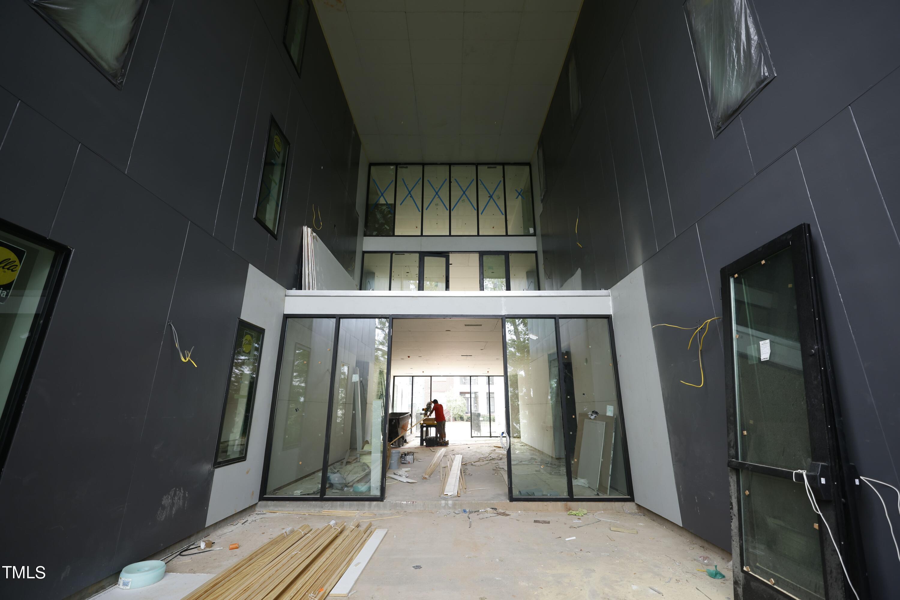 29 Enterprise Street, Unit 311 Raleigh, NC 27607 - Photo 7 of 33 an entryway of a house with wooden floor