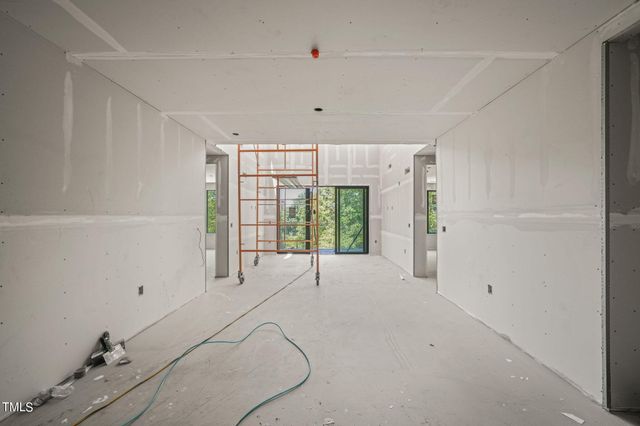 a view of a room with wooden walls and stairs