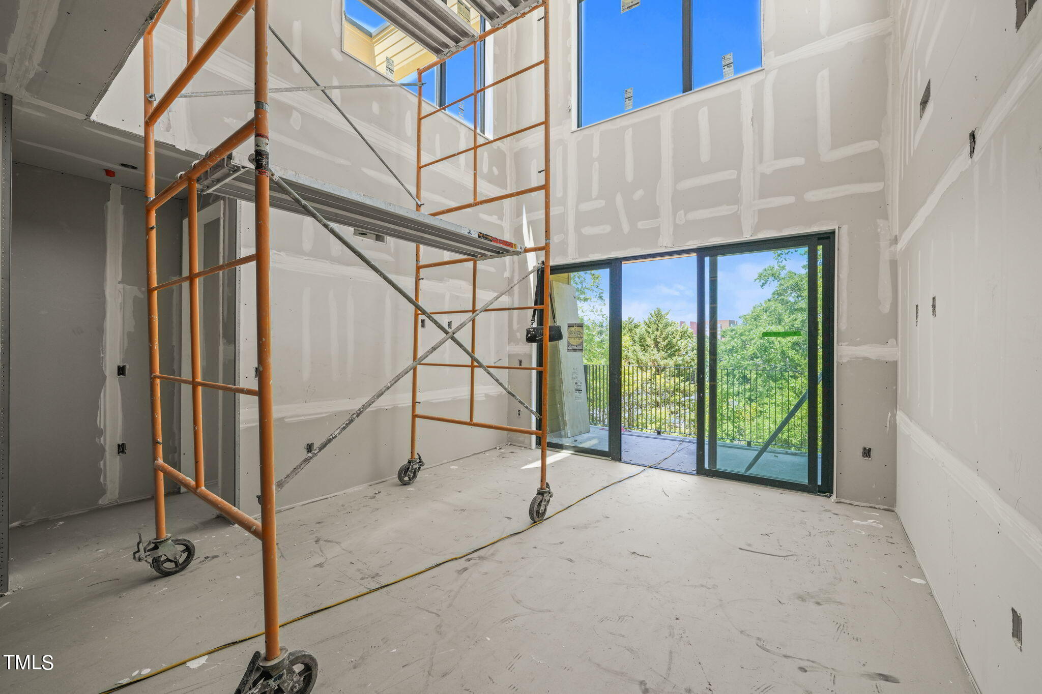29 Enterprise Street, Unit 311 Raleigh, NC 27607 - Photo 10 of 33 a view of a room with wooden walls and stairs